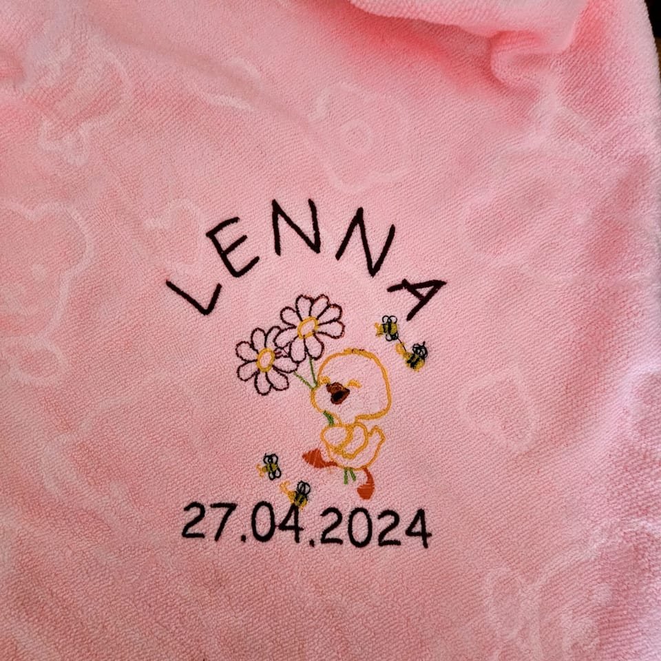 Baby towel with a name and date of birth
