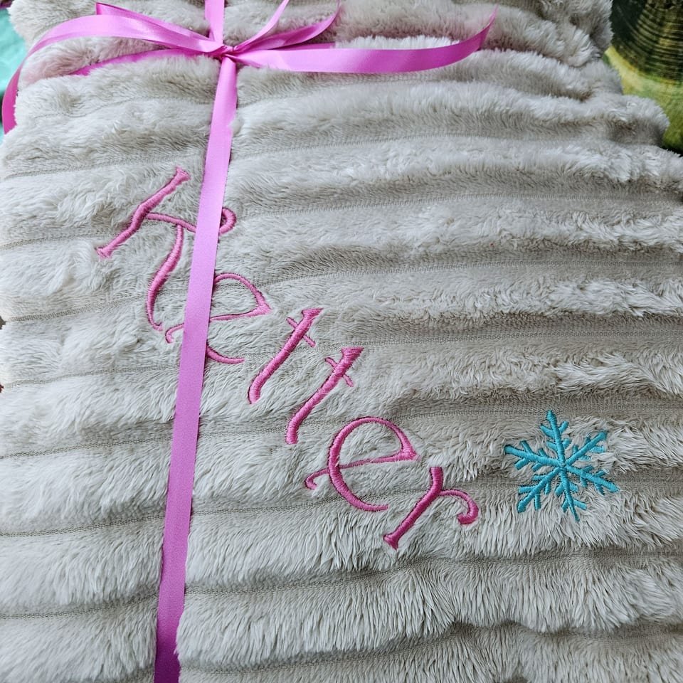 Soft blanket with an embroidered name